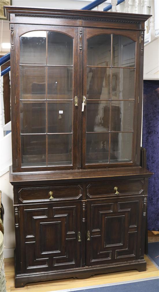 An oak bookcase with glazed top W.126cm